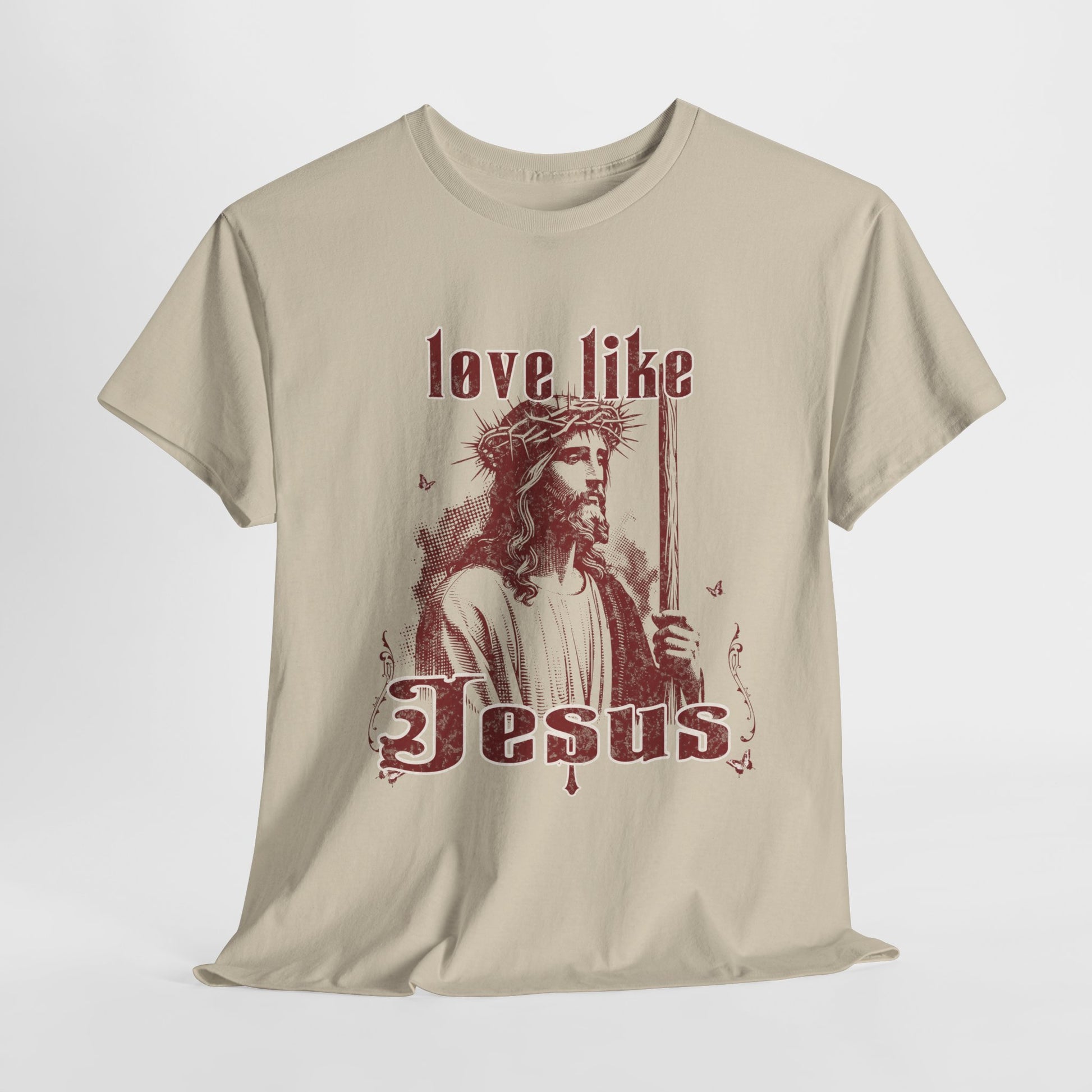 Beige t-shirt with a graphic of Jesus and text 'love like Jesus' on a white background
