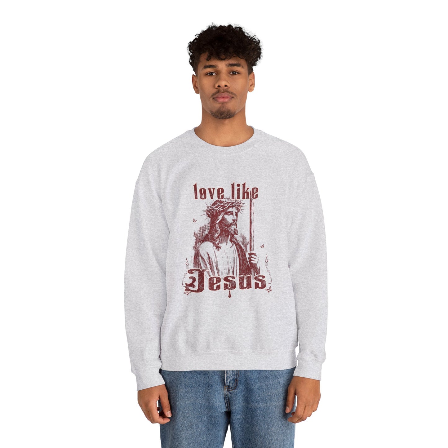 Person wearing a white sweatshirt with 'Love Like Jesus' design on a white background