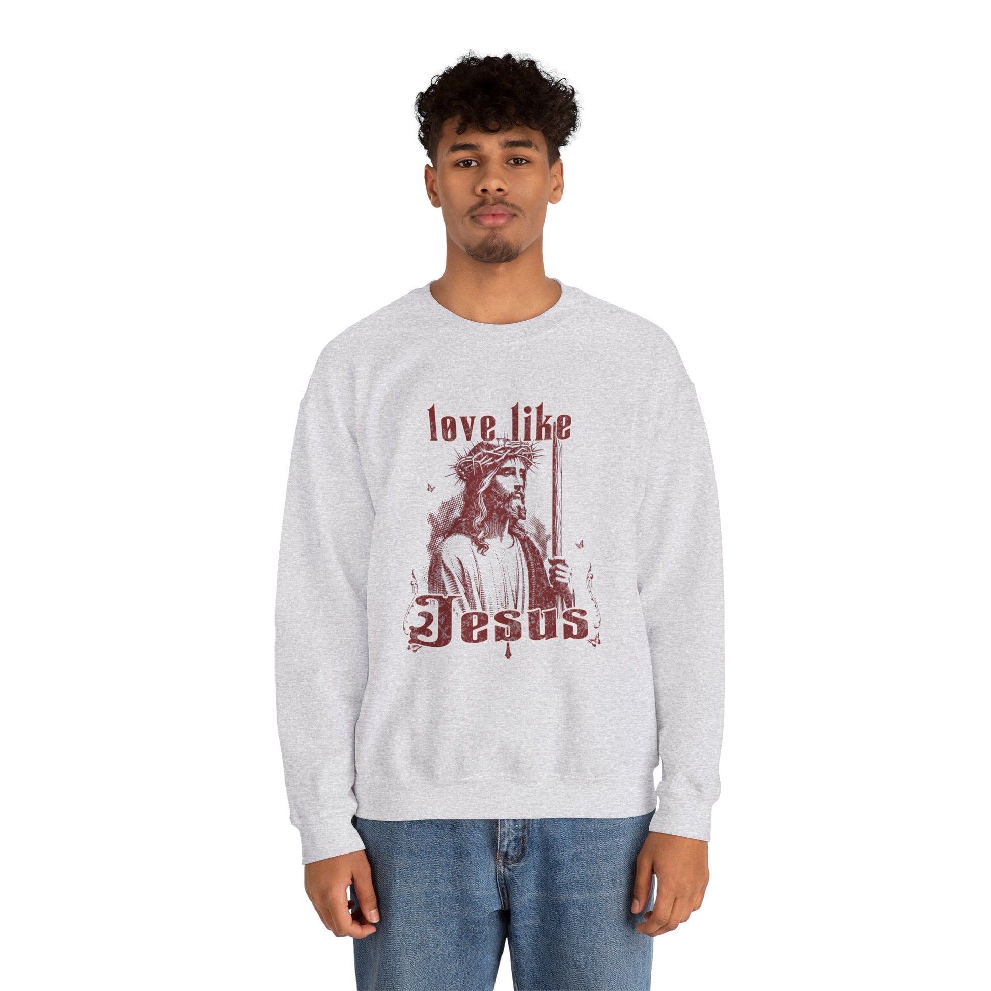 Person wearing a white sweatshirt with 'Love Like Jesus' design on a white background