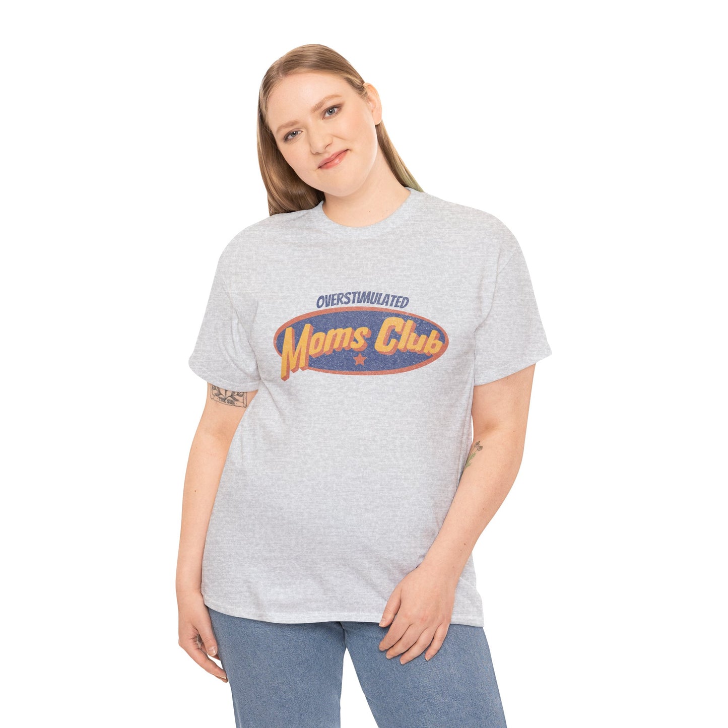 Woman wearing a gray t-shirt with 'Moms Club' print on a white background