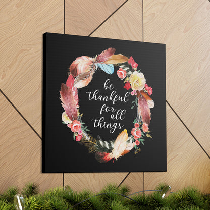 Be Thankful sign canvas with bright feather and flower illustration.

