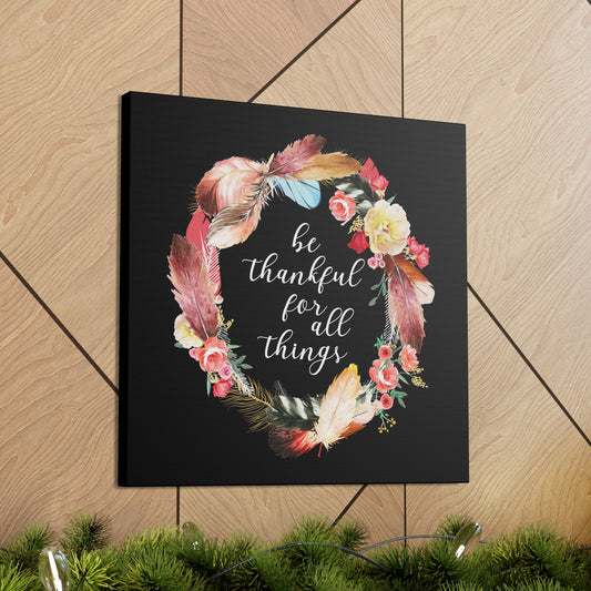 Be Thankful sign canvas with bright feather and flower illustration.
