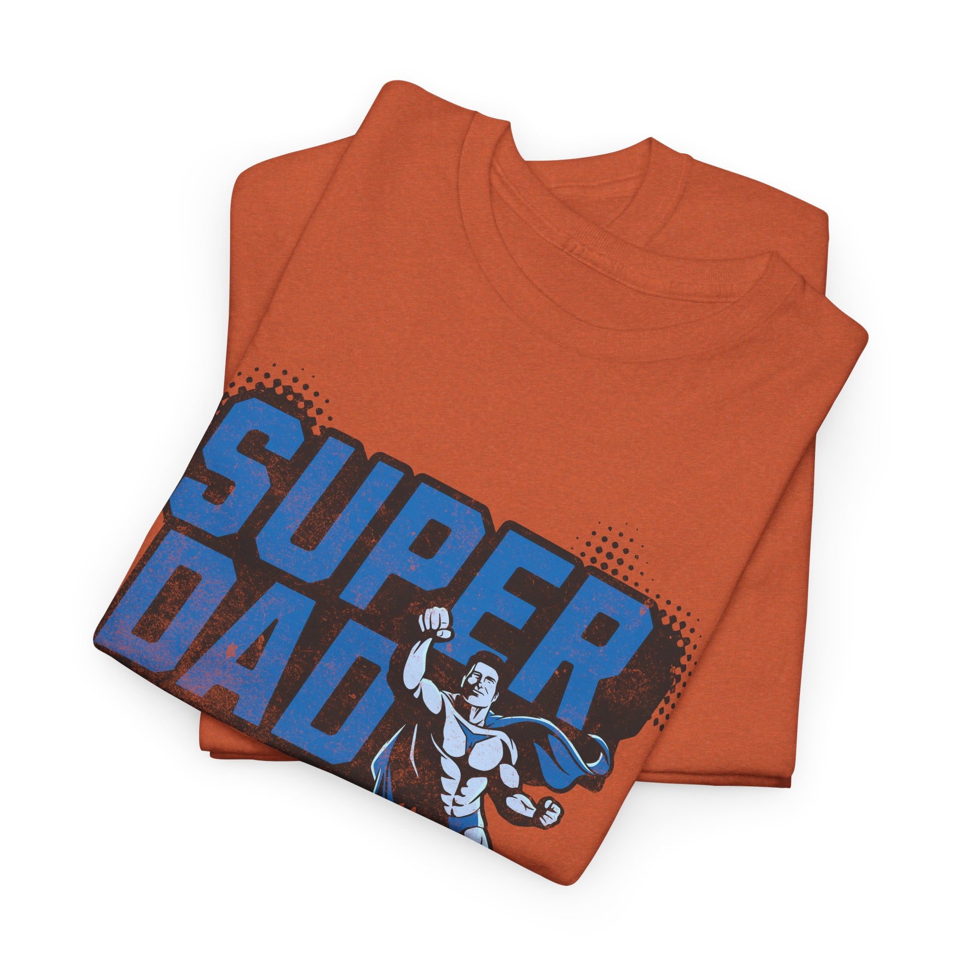 Folded orange t-shirt with 'Super Dad' text and superhero graphic on a white background