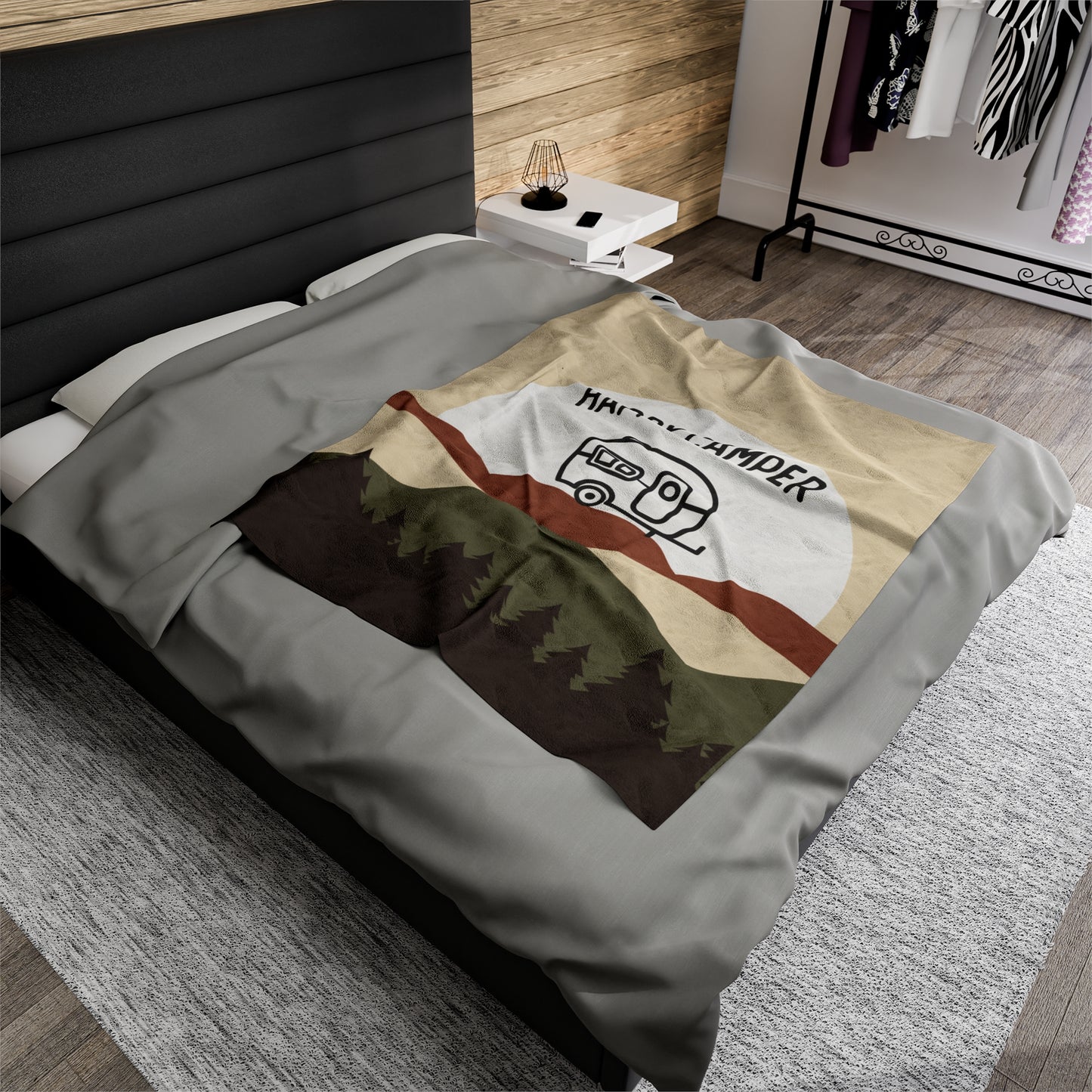 Cozy camping blanket with pine trees, rolling hills, and a full moon
