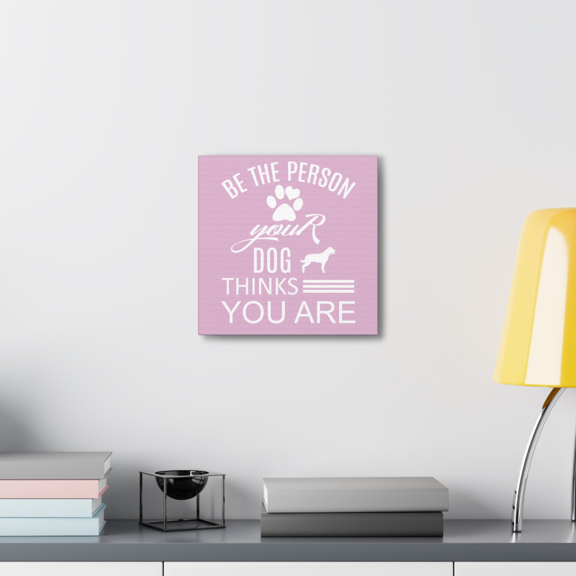 Dog lover sign with pink background and white paw print and text
