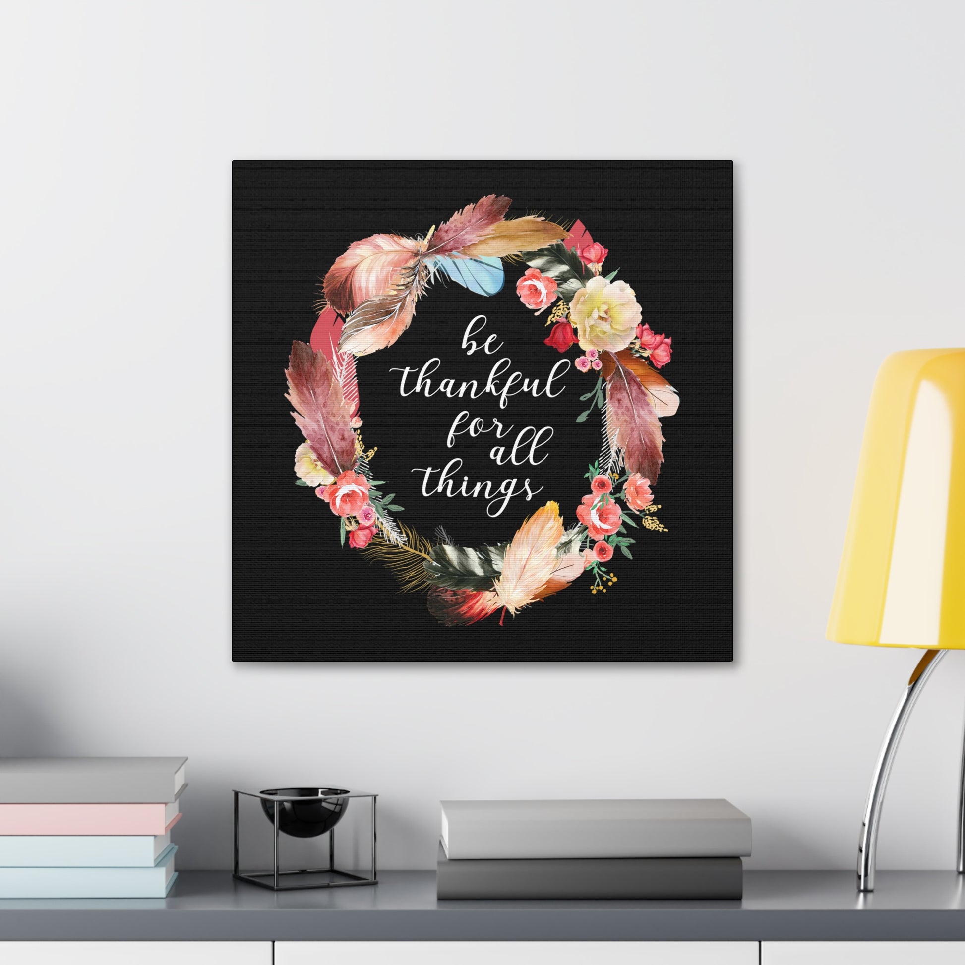 Gratitude-themed wall art featuring colorful floral and feather design.
