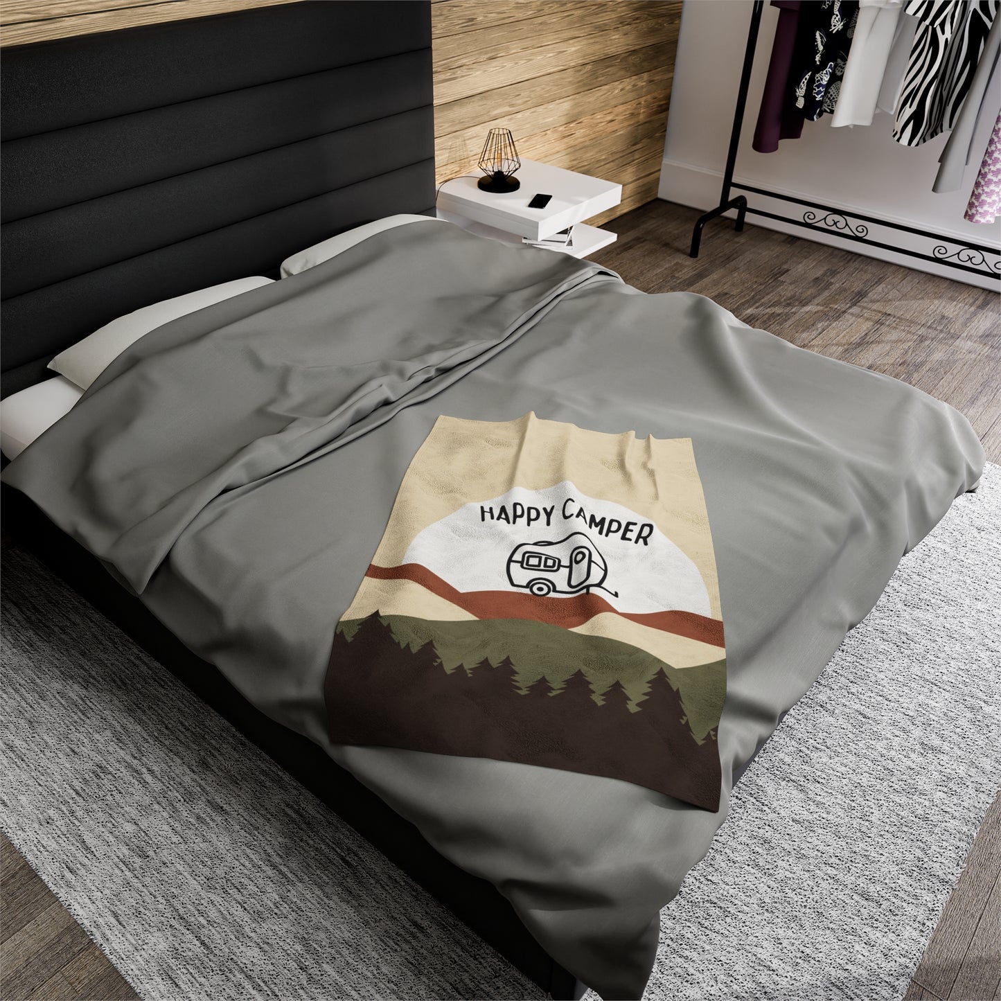 Camping-themed throw blanket displayed in a cozy living space
