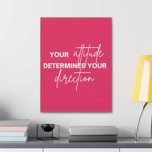 Pink canvas wall art with "Your Attitude Determines Your Direction" in white font.
