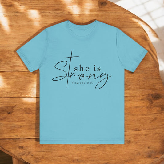 She Is Strong Shirt – Christian Women’s T-Shirt with Proverbs 31:25

