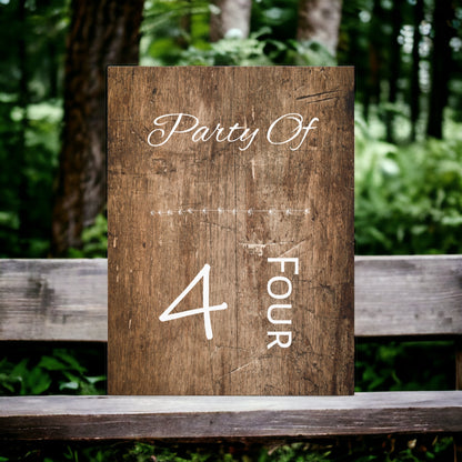 Party of 4 sign wall art with rustic brown wood background.
