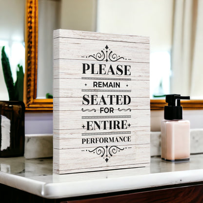 Please Remain Seated Sign – Funny Bathroom Wall Art