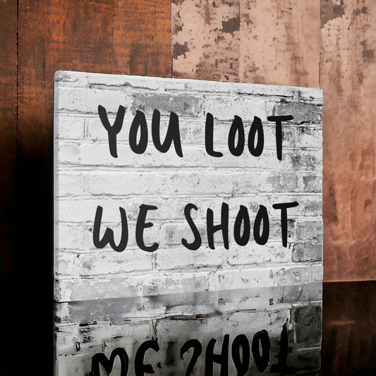 You loot we shoot sign