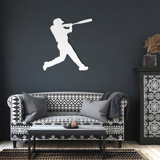 Metal baseball wall art with a player mid-swing
