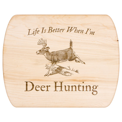Large size hardwood cutting board with deer hunting engraving.