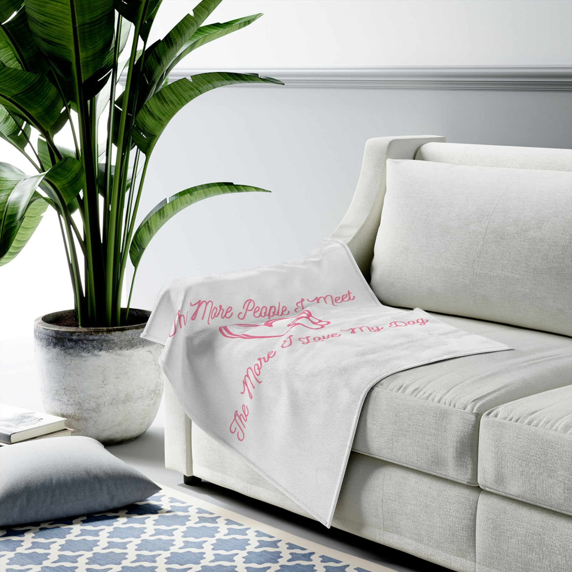 Cute pink blanket with heart and paw print graphic
